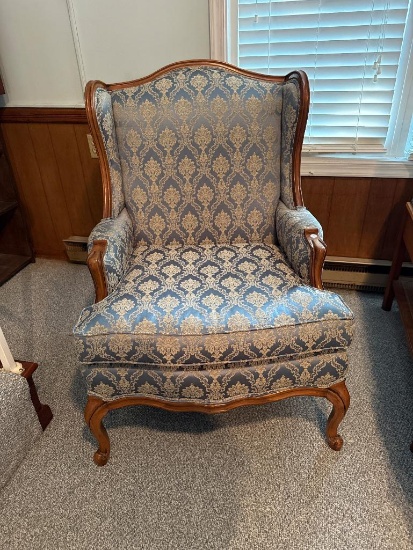 Wingback Armchair With Blue Damask Upholstery and Carved Wood Frame